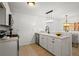 Well-equipped kitchen with modern appliances, countertop and view into the dining area at 365 Norcross St, Roswell, GA 30075