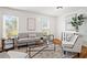 Bright and airy living room with stylish furnishings, hardwood floors and great natural light at 365 Norcross St, Roswell, GA 30075