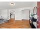 Inviting living room featuring hardwood floors, white walls, and an arched entryway at 365 Norcross St, Roswell, GA 30075