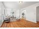 Inviting living room with hardwood floors, neutral decor, and plenty of natural light at 365 Norcross St, Roswell, GA 30075