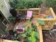 Wooden deck featuring comfortable seating, potted plants, and stairs leading to other areas at 390 Hunt River Way, Suwanee, GA 30024