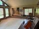 Bright living room featuring large windows, a cozy rocking chair, and potential for customization at 390 Hunt River Way, Suwanee, GA 30024