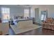 Bright bedroom featuring hardwood floors, neutral walls, plush carpet, and windows at 401 Iona Abbey Ct # 6, Smyrna, GA 30082