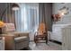 Cozy Bedroom with rocking chair, crib, and soft lighting at 401 Iona Abbey Ct # 6, Smyrna, GA 30082
