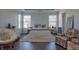 Bright bedroom featuring hardwood floors, neutral walls, plush carpet, and windows at 401 Iona Abbey Ct # 6, Smyrna, GA 30082