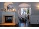 Charming dining area featuring hardwood floors, a chandelier, and views into the living room at 401 Iona Abbey Ct # 6, Smyrna, GA 30082