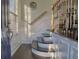 Elegant entryway featuring hardwood floors, staircase with wrought iron railing, and natural light at 401 Iona Abbey Ct # 6, Smyrna, GA 30082