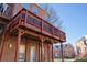 Brick townhome exterior view featuring a wood deck overlooking the backyard at 401 Iona Abbey Ct # 6, Smyrna, GA 30082