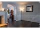 Elegant living room with fireplace, wainscoting, and views into the dining area at 401 Iona Abbey Ct # 6, Smyrna, GA 30082