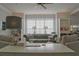 Inviting living space with a stylish couch, built-in shelving, and bright, airy ambiance at 401 Iona Abbey Ct # 6, Smyrna, GA 30082