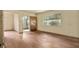 Bright living room with hardwood floors and a glimpse of the sunroom at 1143 Westview Sw Dr, Atlanta, GA 30310