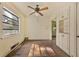 Traditional living room with hardwood floors, built-in cabinets, and a ceiling fan at 1143 Westview Sw Dr, Atlanta, GA 30310
