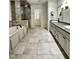 This expansive bathroom features a soaking tub, a glass-enclosed shower, and dual vanities with granite countertops at 2062 Valiant Ne Dr, Atlanta, GA 30345