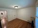 Cozy room with hardwood floors featuring a large window and neutral paint, plus a double door closet at 2062 Valiant Ne Dr, Atlanta, GA 30345