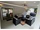 Relaxing covered patio featuring brick accents, overhead fan, and comfortable outdoor furniture for ultimate outdoor enjoyment at 2062 Valiant Ne Dr, Atlanta, GA 30345