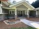 Charming front porch with stone accents, complemented by a well-manicured lawn and welcoming entrance at 2062 Valiant Ne Dr, Atlanta, GA 30345