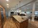 Gourmet kitchen island featuring pendant lighting, granite countertops, and stainless steel appliances at 2062 Valiant Ne Dr, Atlanta, GA 30345