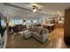 Bright, open-concept space featuring hardwood floors, fireplace, and seamless flow between rooms at 2062 Valiant Ne Dr, Atlanta, GA 30345