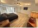 Serene main bedroom featuring hardwood floors, built-ins, and a spacious layout at 2062 Valiant Ne Dr, Atlanta, GA 30345