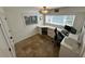Home office with custom L-shaped desk, stone flooring, and two windows providing natural light at 2062 Valiant Ne Dr, Atlanta, GA 30345