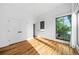 Spacious bedroom featuring natural light, hardwood floors and a double door closet at 23 Walthall Ne St, Atlanta, GA 30317