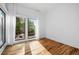 Bright empty bedroom with large windows and hardwood floors, perfect for customization at 23 Walthall Ne St, Atlanta, GA 30317
