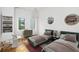 Charming bedroom with twin beds, a table with chairs, and themed decor at 23 Walthall Ne St, Atlanta, GA 30317