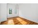 Bright bedroom with hardwood floors and ample natural light at 23 Walthall Ne St, Atlanta, GA 30317