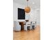 Elegant dining room features a wooden table, stylish chairs, and modern light fixture at 23 Walthall Ne St, Atlanta, GA 30317