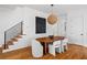 The dining area showcases a wooden table, modern chairs, and stylish artwork at 23 Walthall Ne St, Atlanta, GA 30317