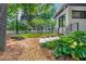 Landscaped side yard featuring a stone walkway and lush greenery, offering a serene and inviting outdoor space at 23 Walthall Ne St, Atlanta, GA 30317