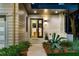 Welcoming entryway featuring a modern door, manicured landscaping, and contemporary exterior finishes at 23 Walthall Ne St, Atlanta, GA 30317