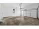 Spacious garage with a modern door and natural light streaming through the windows at 23 Walthall Ne St, Atlanta, GA 30317