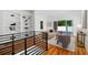 Hallway with staircase featuring built-in bookshelves, and living room view at 23 Walthall Ne St, Atlanta, GA 30317