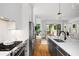 Modern kitchen featuring stainless steel appliances, gas range, and a spacious island with a sink at 23 Walthall Ne St, Atlanta, GA 30317