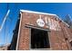 Exterior view of Krog Street Market, a red brick building with a market sign and industrial architectural details at 23 Walthall Ne St, Atlanta, GA 30317