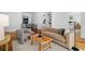 Well-lit living room showcasing hardwood floors, a cozy sofa, and a rustic coffee table at 23 Walthall Ne St, Atlanta, GA 30317