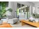 Living room showcases comfortable chairs and coffee table with views to the outdoors at 23 Walthall Ne St, Atlanta, GA 30317