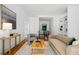 Bright living room featuring hardwood floors, large artwork, and comfortable seating at 23 Walthall Ne St, Atlanta, GA 30317