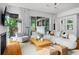 This living room offers a cozy fireplace, soft textures, and access to the outdoor area at 23 Walthall Ne St, Atlanta, GA 30317