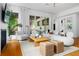Stylish living room offers modern seating, a fireplace, and a view to the outdoors at 23 Walthall Ne St, Atlanta, GA 30317