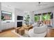 Modern living room boasts a fireplace, sleek furniture, and light hardwood floors at 23 Walthall Ne St, Atlanta, GA 30317