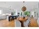 Open concept living area with kitchen, dining, and living space with hardwood flooring and neutral decor at 23 Walthall Ne St, Atlanta, GA 30317