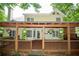 Enjoy outdoor living with a covered back porch, decorative plants, and view of the manicured backyard at 3788 Westwick Nw Ct, Kennesaw, GA 30152