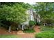 Side view of home showing lush landscaping and gravel area at 3788 Westwick Nw Ct, Kennesaw, GA 30152