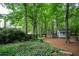 Expansive backyard showcases lush foliage, towering trees, and a charming outbuilding at 3788 Westwick Nw Ct, Kennesaw, GA 30152