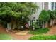 Secluded backyard retreat with gravel area and lush landscaping at 3788 Westwick Nw Ct, Kennesaw, GA 30152