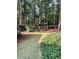 The backyard offers a blend of manicured lawn and natural landscaping, creating a peaceful retreat at 3788 Westwick Nw Ct, Kennesaw, GA 30152