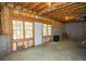 Unfinished basement with access to the backyard, exposed ceilings, and concrete flooring at 3788 Westwick Nw Ct, Kennesaw, GA 30152