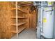 Basement storage area with shelving and a hot water heater at 3788 Westwick Nw Ct, Kennesaw, GA 30152